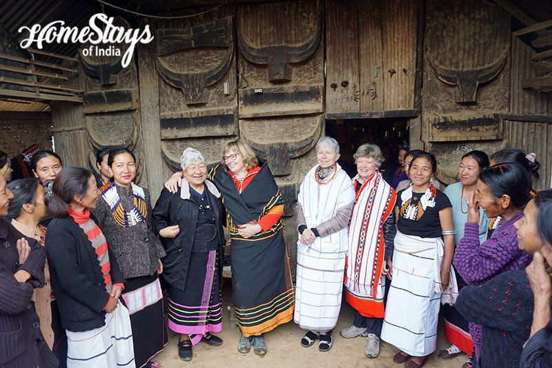 Guests with weavers at Diezephe Homestay Nagaland