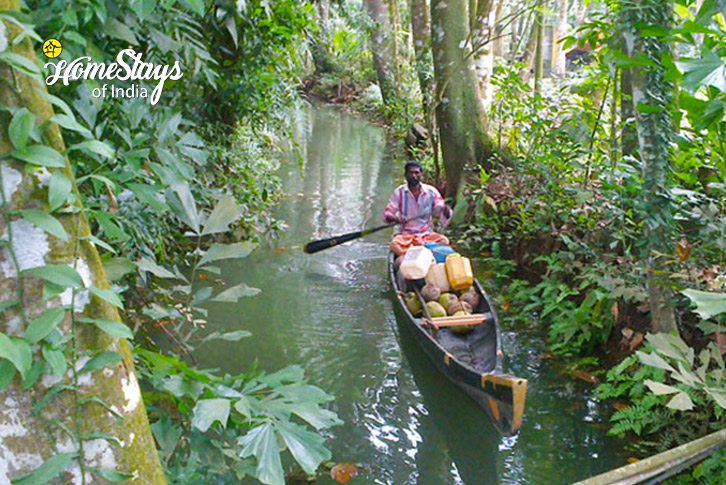 Boating-through-stream-Meenachil Riverside Farmstay-Kottayam